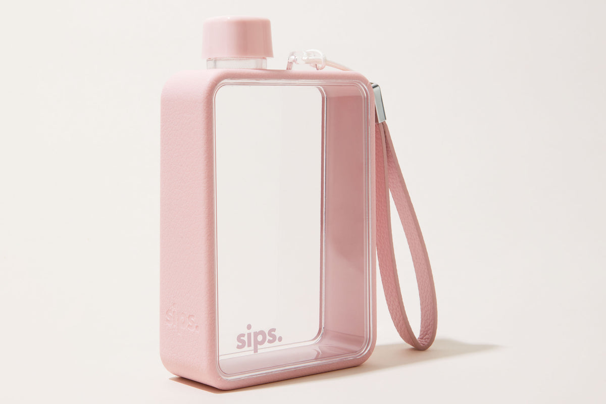 Sips Water bottle in Candy (pale pink) on a white background.