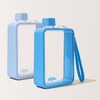 Two rectangular sips. water bottles with clear front panels and blue caps, shown on a clean off-white background. The water bottles have ocean vibes in Sky and Bubblegum (pale blue). The perfect pre  bundled gift.